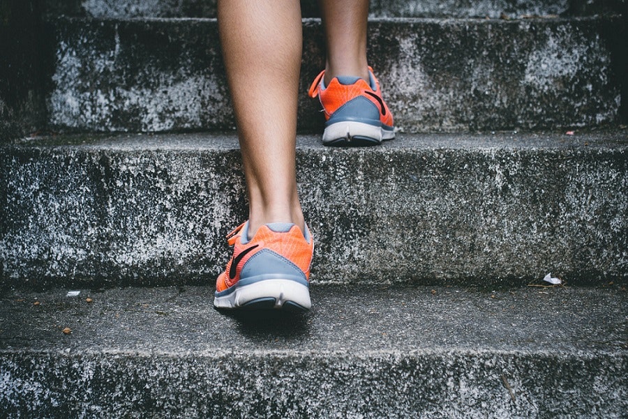 Close up of sportsperson going up step